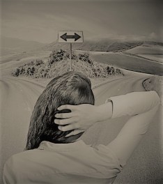 business woman in front of two roads thinking deciding